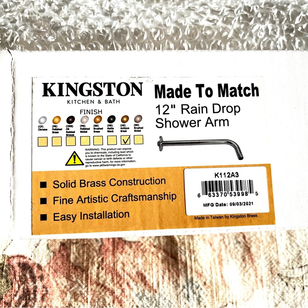 Kingston Brass 12” Raindrop Shower Arm in Antique Brass.